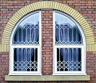 Seceuroguard grilles behind arched windows